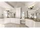 Luxury bathroom showcasing dual vanities with granite countertops and tiled floors at 2539 Sagebrush Trl, Buford, GA 30519