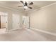 Bedroom with carpet, ceiling fan, and ensuite bathroom and closet at 2539 Sagebrush Trl, Buford, GA 30519