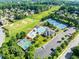 Aerial view of community amenities: pool, tennis, basketball courts, field, and parking at 2539 Sagebrush Trl, Buford, GA 30519