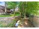 Secluded backyard with a creek adding natural beauty to the landscape and creating a private oasis at 2539 Sagebrush Trl, Buford, GA 30519