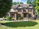 Beautiful brick home with manicured lawn and lush landscaping in a desirable neighborhood at 2539 Sagebrush Trl, Buford, GA 30519