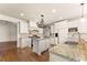Well-appointed kitchen featuring stainless steel appliances, granite countertops, and large island at 2539 Sagebrush Trl, Buford, GA 30519