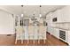 Charming kitchen with island, barstool seating, and adjacent dining area at 2539 Sagebrush Trl, Buford, GA 30519