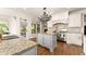 Large kitchen featuring stainless appliances, granite countertops, and eat-in island at 2539 Sagebrush Trl, Buford, GA 30519