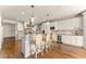 Elegant kitchen with island seating, wine cooler, and custom cabinetry at 2539 Sagebrush Trl, Buford, GA 30519
