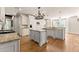 Gourmet kitchen with white cabinets, granite countertops, and stainless steel appliances at 2539 Sagebrush Trl, Buford, GA 30519