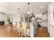 Open concept kitchen with island seating, stainless steel appliances, and stone countertops at 2539 Sagebrush Trl, Buford, GA 30519