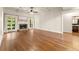 Spacious living room with fireplace, hardwood floors, and many windows at 2539 Sagebrush Trl, Buford, GA 30519