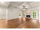 Spacious living room featuring a coffered ceiling, fireplace, and hardwood floors at 2539 Sagebrush Trl, Buford, GA 30519