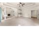 Bright living room showcasing a fireplace, wet bar, and open layout with neutral carpeting at 2539 Sagebrush Trl, Buford, GA 30519