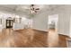 Open concept living room with hardwood floors and view of staircase and front door at 2539 Sagebrush Trl, Buford, GA 30519