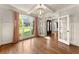 Elegant living room with hardwood floors, coffered ceilings, and large windows at 2539 Sagebrush Trl, Buford, GA 30519