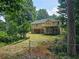 Expansive backyard with a deck and partially-covered patio, great for entertaining at 312 N Briar Rdg, Woodstock, GA 30189