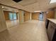 Finished basement featuring tile flooring, utility sink, and access to the outside at 312 N Briar Rdg, Woodstock, GA 30189