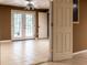 Bright, finished basement featuring tile flooring and double doors to the outside at 312 N Briar Rdg, Woodstock, GA 30189