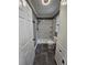 Nicely remodeled bathroom with a tiled shower, glass shelves, and updated toilet at 312 N Briar Rdg, Woodstock, GA 30189