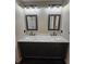 Bathroom featuring dual sinks with marble countertop and dark wood cabinets at 312 N Briar Rdg, Woodstock, GA 30189
