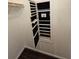 Closet with jewelry storage cabinet and hardwood floors at 312 N Briar Rdg, Woodstock, GA 30189