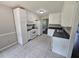Updated kitchen with white cabinets, stainless appliances, and backyard views at 312 N Briar Rdg, Woodstock, GA 30189