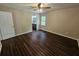 Bright and airy main bedroom with hardwood floors and bathroom views at 312 N Briar Rdg, Woodstock, GA 30189