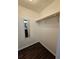 Walk-in closet with hardwood flooring and custom shelving at 312 N Briar Rdg, Woodstock, GA 30189