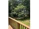 Inviting backyard with lush greenery viewed from wooden deck at 504 Tracy Ct, Lawrenceville, GA 30046