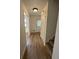 Inviting hallway boasts updated flooring and neutral paint, leading to various rooms in the home at 504 Tracy Ct, Lawrenceville, GA 30046