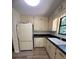 Functional kitchen featuring laminate counters and white appliances at 504 Tracy Ct, Lawrenceville, GA 30046