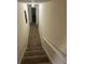 Carpeted stairwell with neutral walls leading to the upper level at 504 Tracy Ct, Lawrenceville, GA 30046