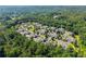 Wide aerial shot showcasing the community nestled among trees and surrounding landscape at 5228 Stone Village Circle Northwest #14 Nw Cir # 14, Kennesaw, GA 30152