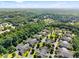 Expansive aerial view of the community surrounded by lush greenery and mature trees at 5228 Stone Village Circle Northwest #14 Nw Cir # 14, Kennesaw, GA 30152