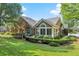 Beautiful backyard with manicured lawn, stone and siding exterior, and inviting patio space at 5228 Stone Village Circle Northwest #14 Nw Cir # 14, Kennesaw, GA 30152
