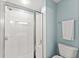 Bright bathroom featuring a glass-enclosed shower and modern fixtures against light blue walls at 5228 Stone Village Circle Northwest #14 Nw Cir # 14, Kennesaw, GA 30152