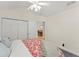 Cozy bedroom featuring closet, ceiling fan, carpeted floor and doorway to the dining room at 5228 Stone Village Circle Northwest #14 Nw Cir # 14, Kennesaw, GA 30152