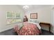Bedroom featuring a large window for natural light, carpeted floor, and a cozy ambiance at 5228 Stone Village Circle Northwest #14 Nw Cir # 14, Kennesaw, GA 30152
