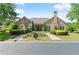 Attractive stone clubhouse with well-manicured landscaping and ample parking at 5228 Stone Village Circle Northwest #14 Nw Cir # 14, Kennesaw, GA 30152