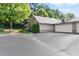 Exterior shot showcasing the stone and siding architecture, two-car garage and landscaped yard at 5228 Stone Village Circle Northwest #14 Nw Cir # 14, Kennesaw, GA 30152