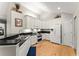 Bright kitchen featuring granite countertops, white cabinets, and stainless steel appliances at 5228 Stone Village Circle Northwest #14 Nw Cir # 14, Kennesaw, GA 30152