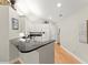 Bright kitchen with white cabinetry, granite countertops, and stainless steel appliances at 5228 Stone Village Circle Northwest #14 Nw Cir # 14, Kennesaw, GA 30152