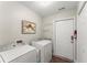 Functional laundry room with modern washer and dryer, ample storage, and easy access at 5228 Stone Village Circle Northwest #14 Nw Cir # 14, Kennesaw, GA 30152