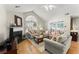 Bright living room featuring a fireplace, hardwood floors, and comfortable seating arrangement at 5228 Stone Village Circle Northwest #14 Nw Cir # 14, Kennesaw, GA 30152
