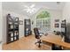 Bright home office with large window, wood flooring, and plenty of workspace at 5228 Stone Village Circle Northwest #14 Nw Cir # 14, Kennesaw, GA 30152