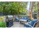 Outdoor patio featuring a built-in grill and comfortable seating, perfect for entertaining at 5228 Stone Village Circle Northwest #14 Nw Cir # 14, Kennesaw, GA 30152