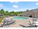 Relaxing community pool with lounge seating and cabana surrounded by lush landscaping at 5228 Stone Village Circle Northwest #14 Nw Cir # 14, Kennesaw, GA 30152