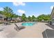 Community pool with lots of seating, tables and mature trees in a beautiful setting at 5228 Stone Village Circle Northwest #14 Nw Cir # 14, Kennesaw, GA 30152