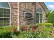 Elegant 'Stonebrooke Village' community sign amidst manicured landscaping and stone building facade at 5228 Stone Village Circle Northwest #14 Nw Cir # 14, Kennesaw, GA 30152