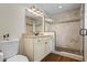 Updated bathroom boasts a granite countertop, tile flooring, and a sleek, glass-enclosed shower at 110 Village Ct, Woodstock, GA 30188