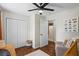 Comfortable Bedroom featuring wood floors, a closet, a doorway, and a seating area at 110 Village Ct, Woodstock, GA 30188