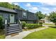 Inviting front entrance featuring well-maintained landscaping and a walkway, enhancing the home's charm at 110 Village Ct, Woodstock, GA 30188