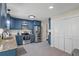 Modern kitchen featuring blue cabinets, stainless steel appliances, and ample counter space for cooking at 110 Village Ct, Woodstock, GA 30188